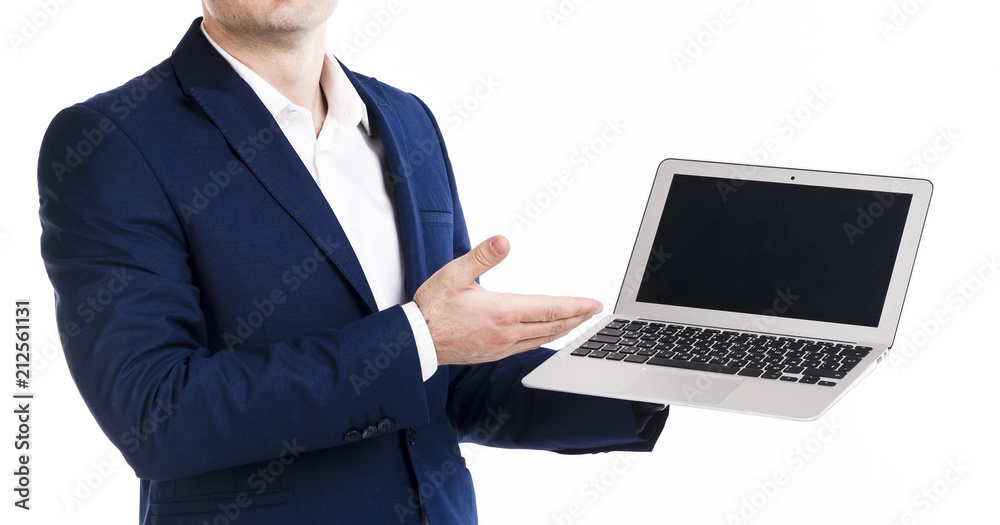 Businessman in elegant blue suit pointing on blank screen of laptop. Empty screen, Isolated on white background, copy space. No face. Businessman in elegant blue suit pointing on blank screen of laptop. Empty screen, Isolated on white background, copy space. No face.