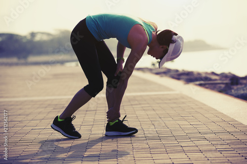 woman runner with sports running knee injury