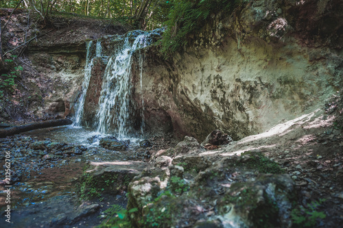 Dauda waterfall in dry summer .Small waterfall in Gauja national park. Latvia. Soft focus. photo