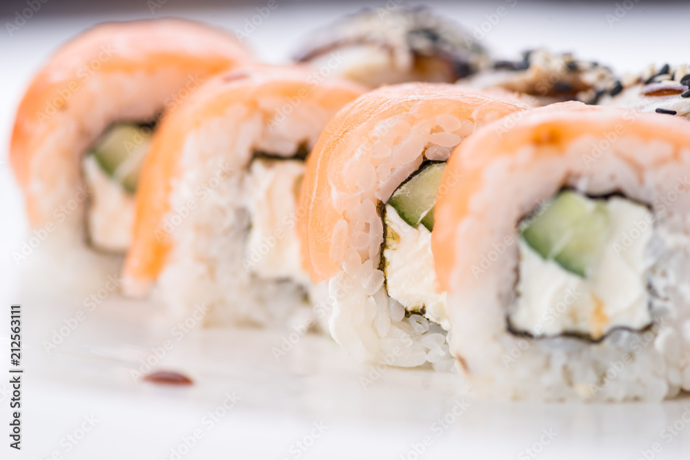 Sushi set and composition at white background. Japanese food restaurant, sushi maki gunkan roll plate or platter set. Sushi set and composition at white background. Japanese food restaurant, sushi maki gunkan roll plate or platter set.
