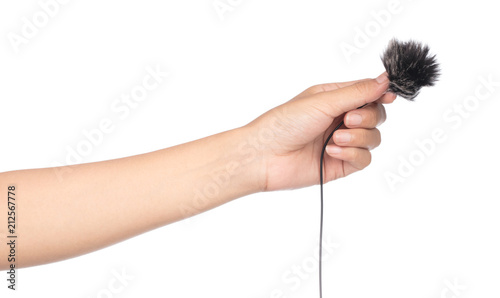 hand holding fur for microphone isolated on white background. photo