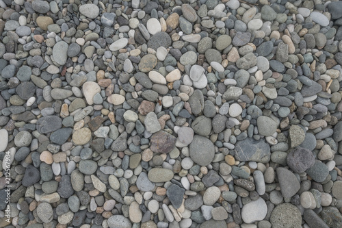 pebble on beach on sunny day abstract pattern texture background