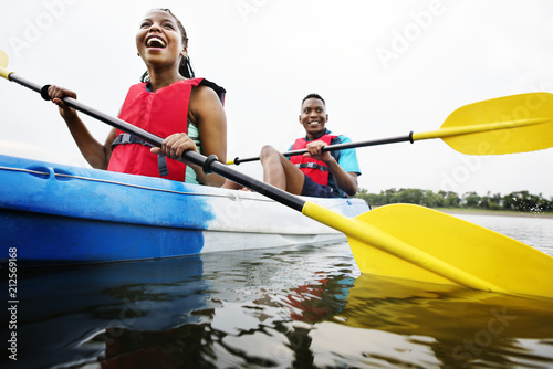 Couple canoeing in lake