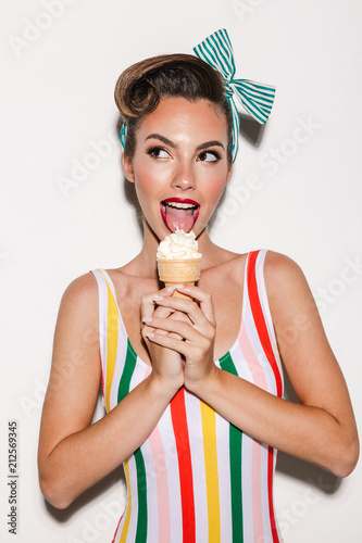 Beautiful pin up woman eating ice cream.