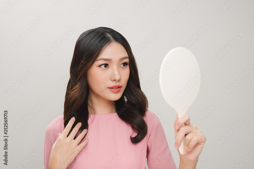 health, beauty and spa - smiling woman looking at mirror health, beauty and spa - smiling woman looking at mirror