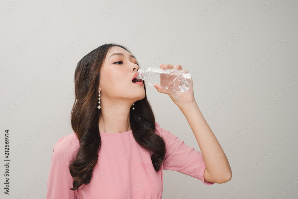 Face portrait of woman drinking water. Smiling girl. Isolated portrait. Face portrait of woman drinking water. Smiling girl. Isolated portrait.