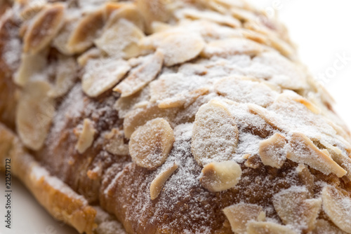 Almond croissant  filled with almond cream and topped with sliced almonds