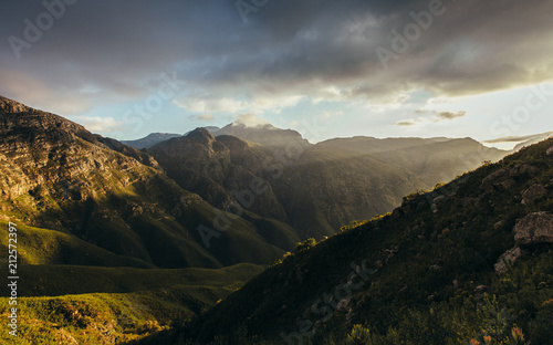 Sun rays lighting up the mountain valley