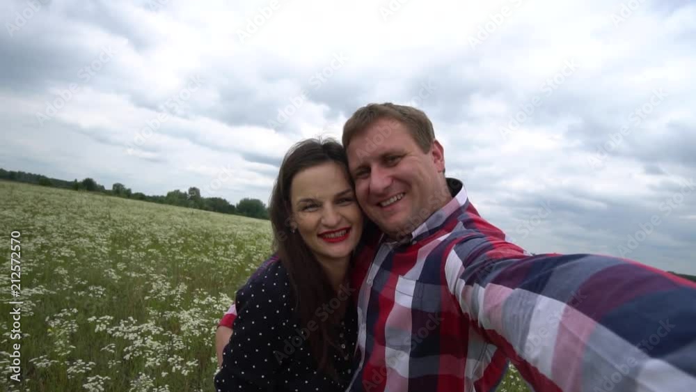 Romantic Happy Couple In Love Taking Photos On Phone In Nature. Romantic Happy Couple In Love Taking Photos On Phone In Nature.