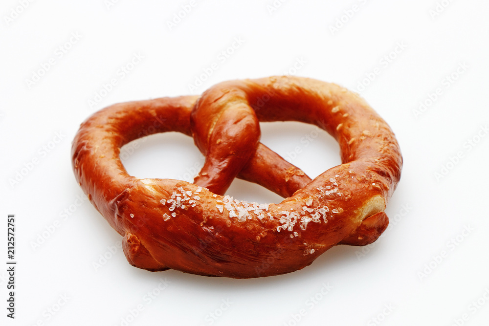 Delicious fresh salted pretzel on white background Delicious fresh salted pretzel on white background