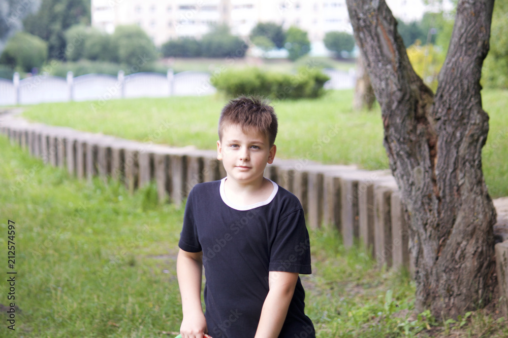 Portrait of a teenager on the background of a concrete wall. Portrait of a teenager on the background of a concrete wall.