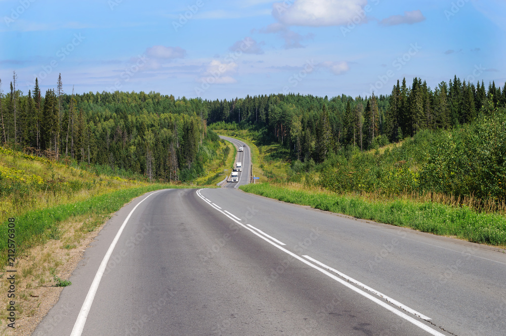 Obraz premium Asphalt road across the hills