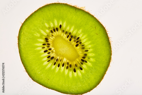 Fresh, beautiful,kiwi, sliced, photographed in macro closeup on white background.