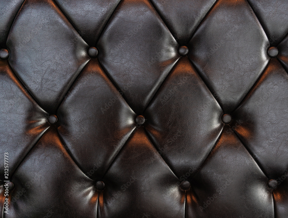 Obraz premium Elegant luxury dark brown leather with buttons. Leather pattern texture background