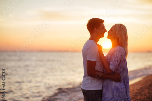 Young happy couple on seashore. © Margo Basarab
