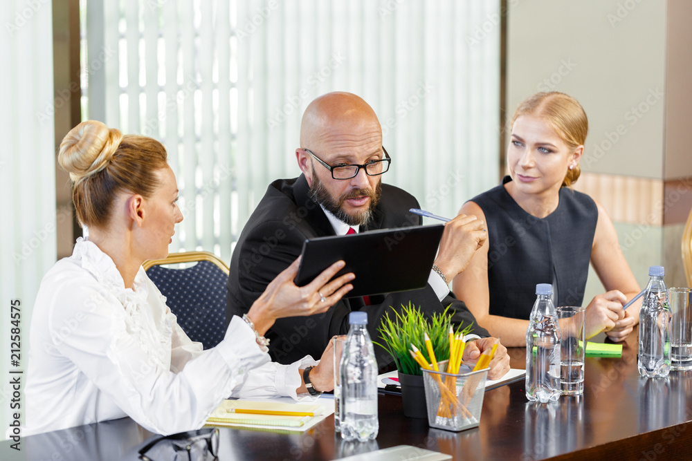 Business people working together at conference table Business people working together at conference table