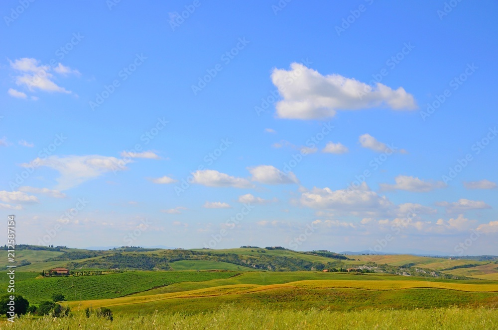 Beautiful landscape of hills, cypress trees and houses in Tuscany, Italy