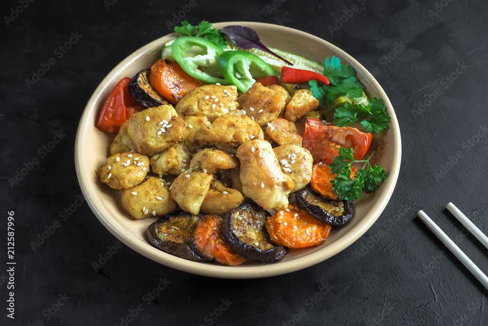 Pieces of baked meat with grilled vegetables on a plate. Chinese cuisine. Pieces of baked meat with grilled vegetables on a plate. Chinese cuisine.