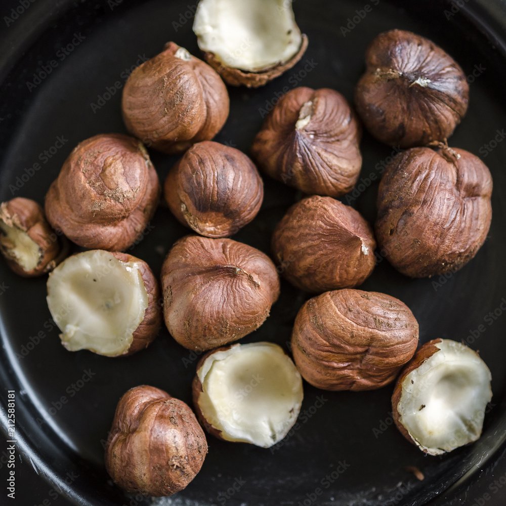 Hazelnuts nuts in bowl. Food background. Close up Hazelnuts nuts in bowl. Food background. Close up