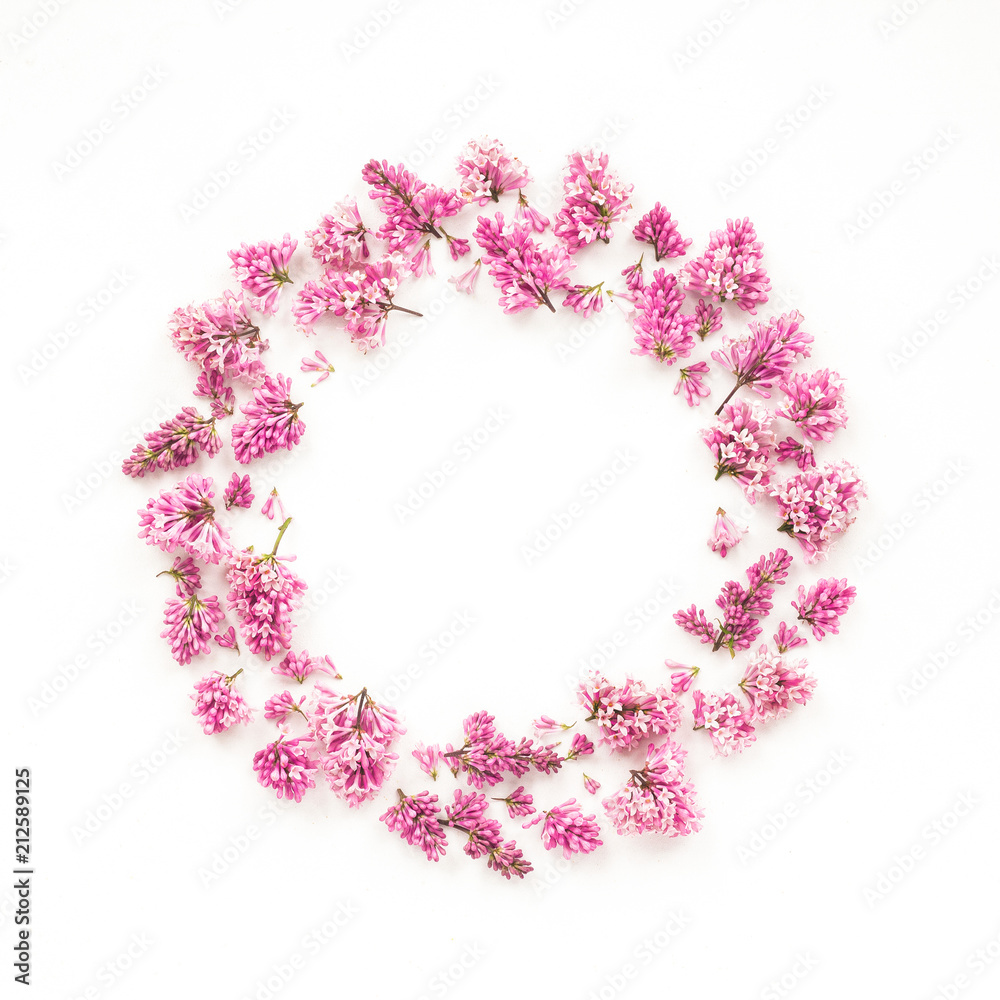 Wreath made of lilac flowers on white background, flat lay, top view