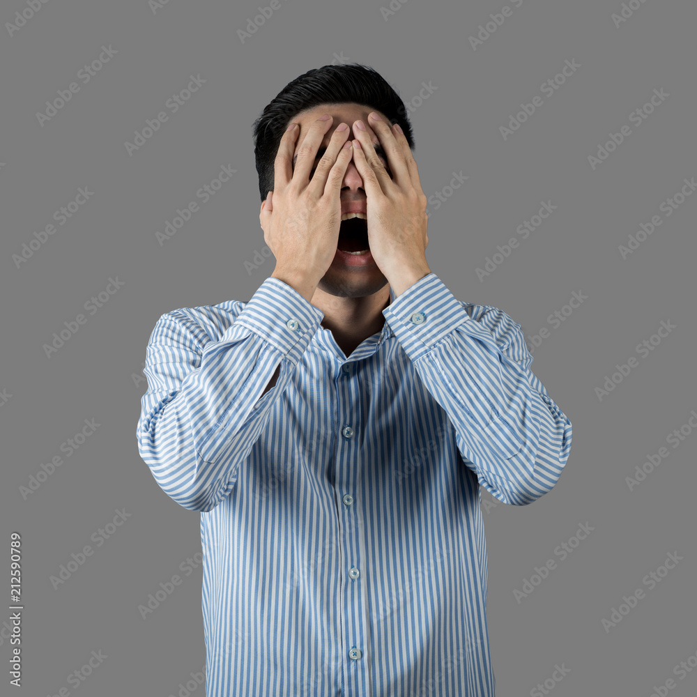 Portrait stressed and anxiety handsome young asian man wearing a blue shirt isolated on gray wall background. Asia people. Portrait stressed and anxiety handsome young asian man wearing a blue shirt isolated on gray wall background. Asia people.