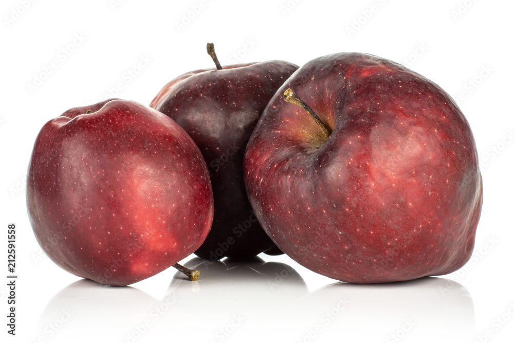 Fototapeta premium Three red delicious apples deep red isolated on white background.