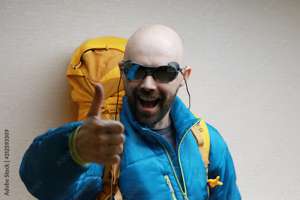 man with backpack, tourist, brutal journey, hike, the concept of active male recreation, portrait of a severe, brutal man, guy preparing equipment for the mountains man with backpack, tourist, brutal journey, hike, the concept of active male recreation, portrait of a severe, brutal man, guy preparing equipment for the mountains