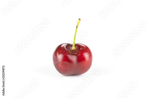 One whole sweet bright red cherry isolated on white...........................................................................