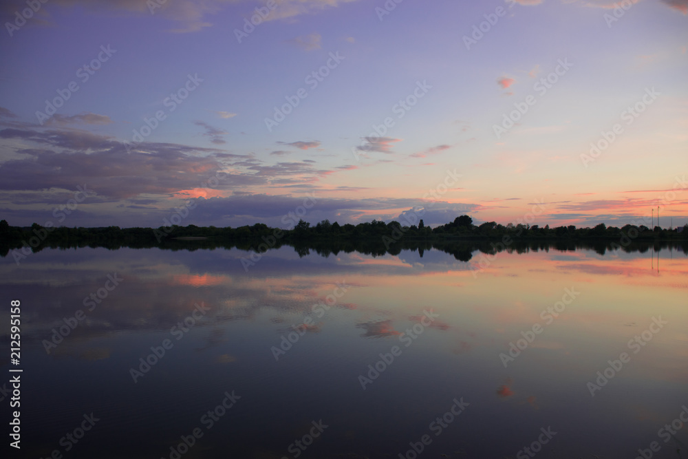 Purple sunset - sky reflect in calm lake