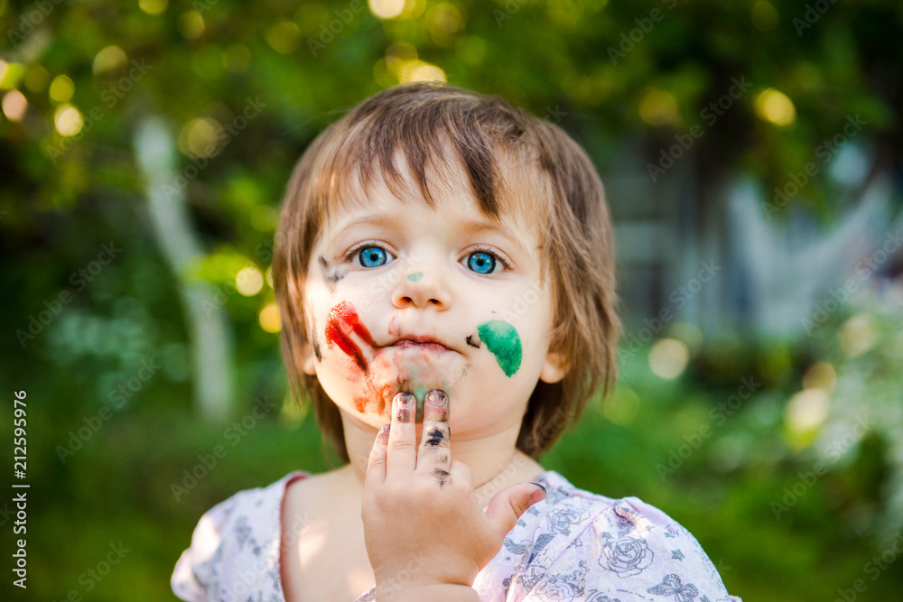 little girl is drawing. Young artist. Painting. Funny girl in the park. activity for children. funny girl painted her face. Dirty face
little girl is drawing. Young artist. Painting. Funny girl in the park. activity for children. funny girl painted her face. Dirty face