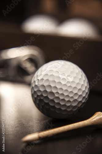 Closeup golf ball on the dark background