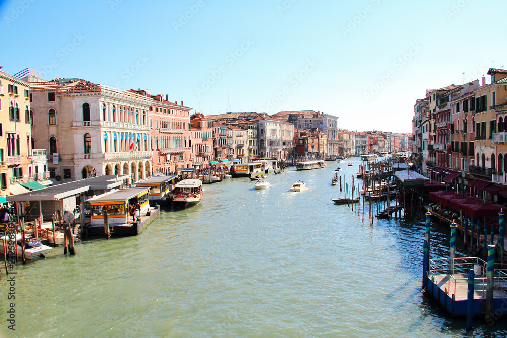 Boats along the Grand Canal of Venice in daylight.
