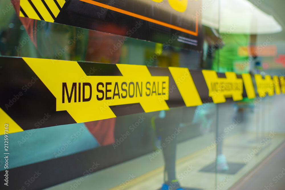 Sale in the middle of the season, the inscription about discounts in the shopping center. Discount Promotion Selling Concept Sale in the middle of the season, the inscription about discounts in the shopping center. Discount Promotion Selling Concept