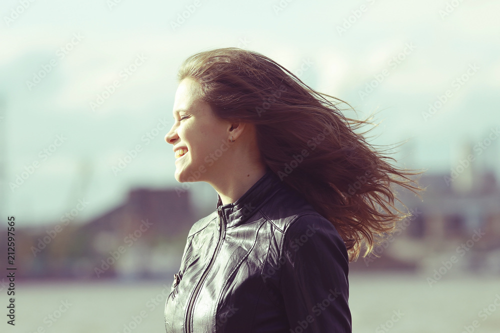 Autumn portrait of a beautiful urban girl adult wind weather climate Autumn portrait of a beautiful urban girl adult wind weather climate