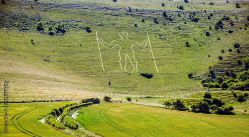 The ancient Long Man of Wilmington chalk hill figure photo