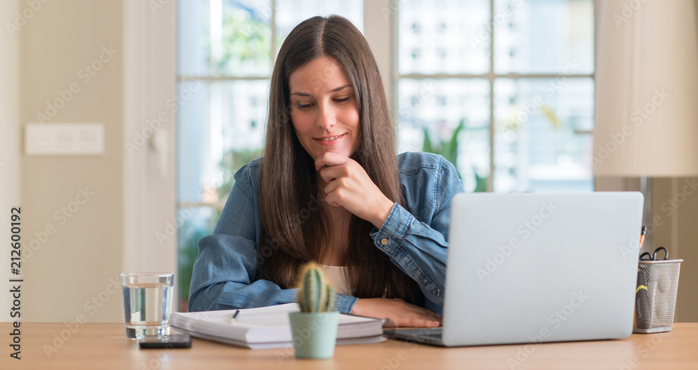 Young student woman studying at home serious face thinking about question, very confused idea Young student woman studying at home serious face thinking about question, very confused idea