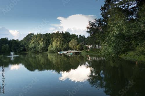 Pier, pontoon on the lake with boats and a catamarans. photo