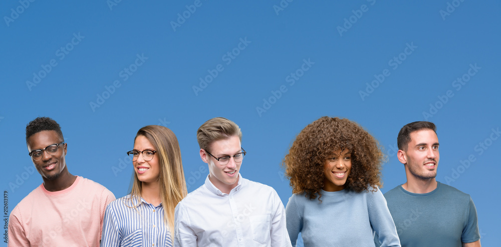 Composition of group of friends over blue blackground looking away to side with smile on face, natural expression. Laughing confident. Composition of group of friends over blue blackground looking away to side with smile on face, natural expression. Laughing confident.