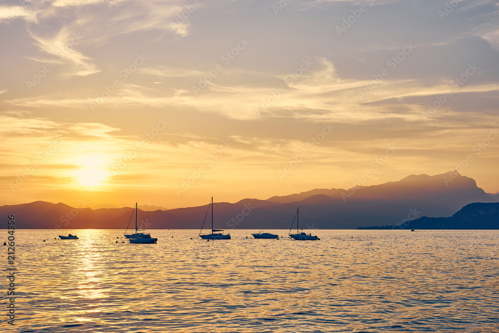Spectacular sunset with beautiful light at City of Bardolino / Lake Garda in Italy Spectacular sunset with beautiful light at City of Bardolino / Lake Garda in Italy