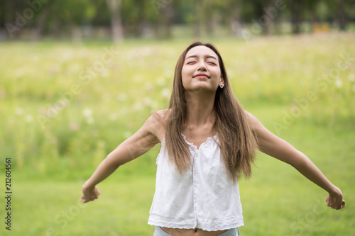 woman breathe fresh air in summer park