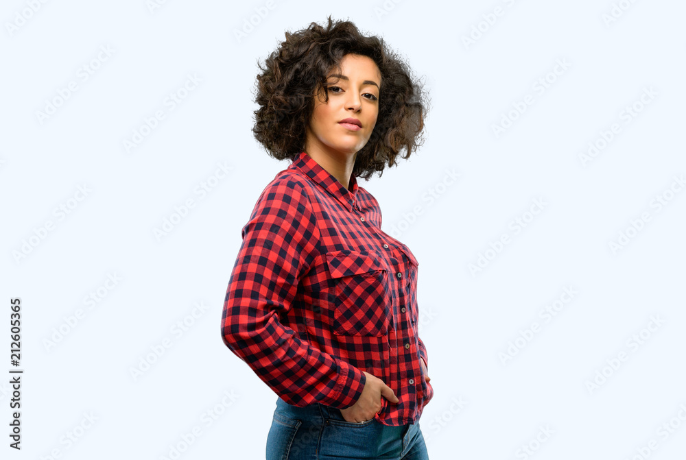 Beautiful arab woman confident and happy with a big natural smile looking at camera Beautiful arab woman confident and happy with a big natural smile looking at camera