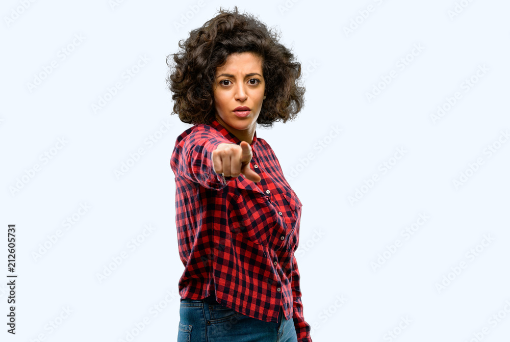 Beautiful arab woman pointing to the front with finger Beautiful arab woman pointing to the front with finger