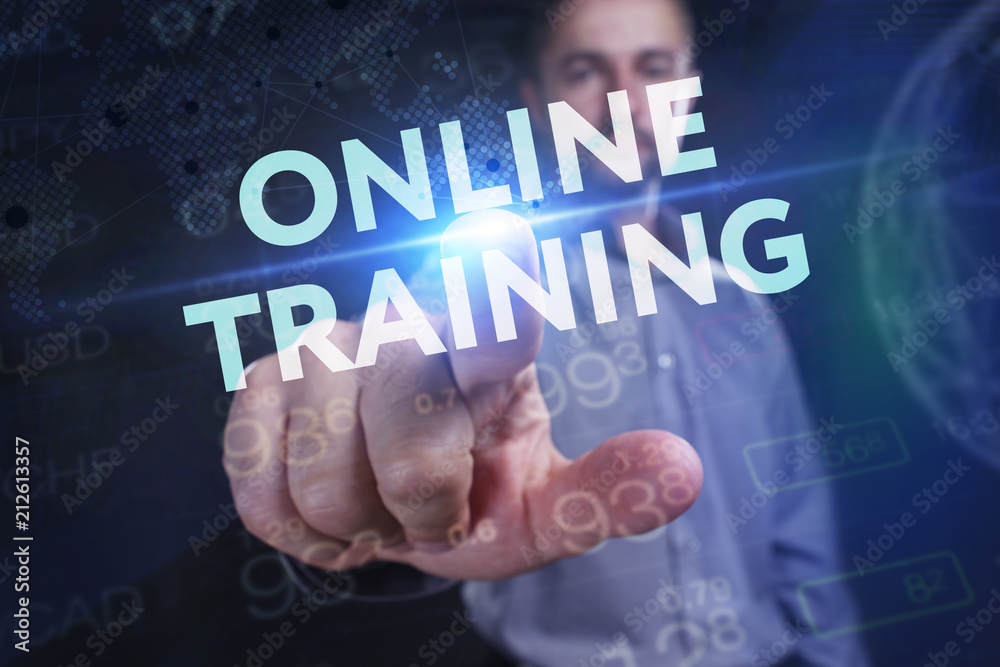 The concept of business, technology, the Internet and the network. A young entrepreneur working on a virtual screen of the future and sees the inscription: Online training The concept of business, technology, the Internet and the network. A young entrepreneur working on a virtual screen of the future and sees the inscription: Online training