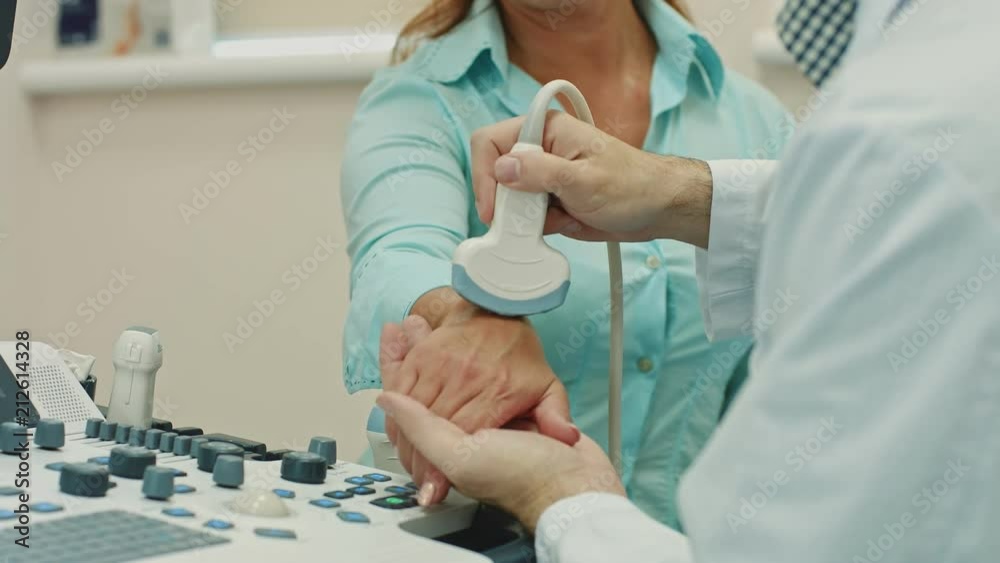 Woman getting wrist ultrasound scanning Woman getting wrist ultrasound scanning