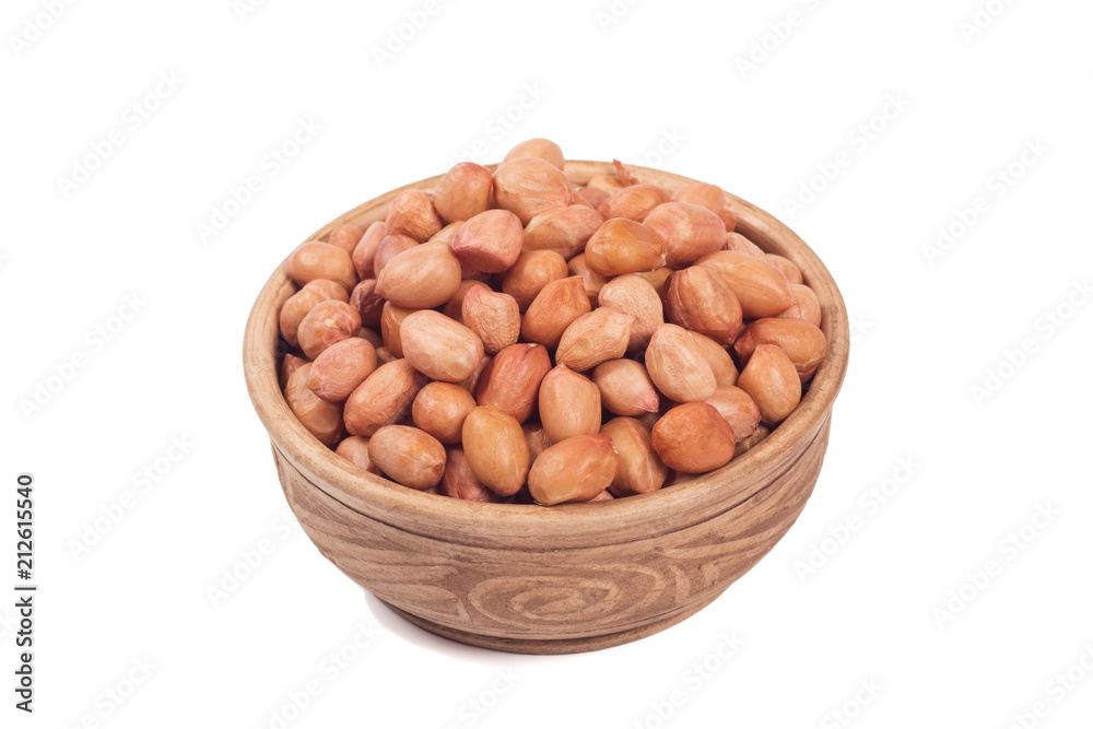 Shelled peanuts in brown cup isolated on the white background Shelled peanuts in brown cup isolated on the white background
