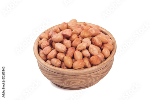 Shelled peanuts in brown cup isolated on the white background