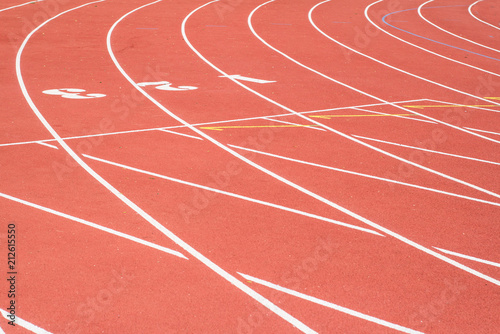 All-weather running track   orange and white lanes for running training