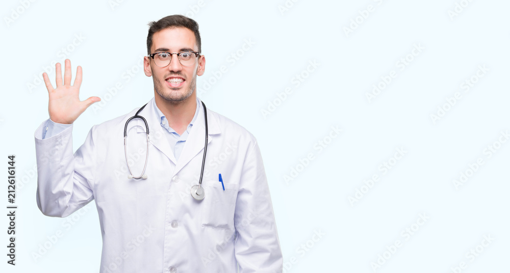 Handsome young doctor man showing and pointing up with fingers number five while smiling confident and happy. Handsome young doctor man showing and pointing up with fingers number five while smiling confident and happy.