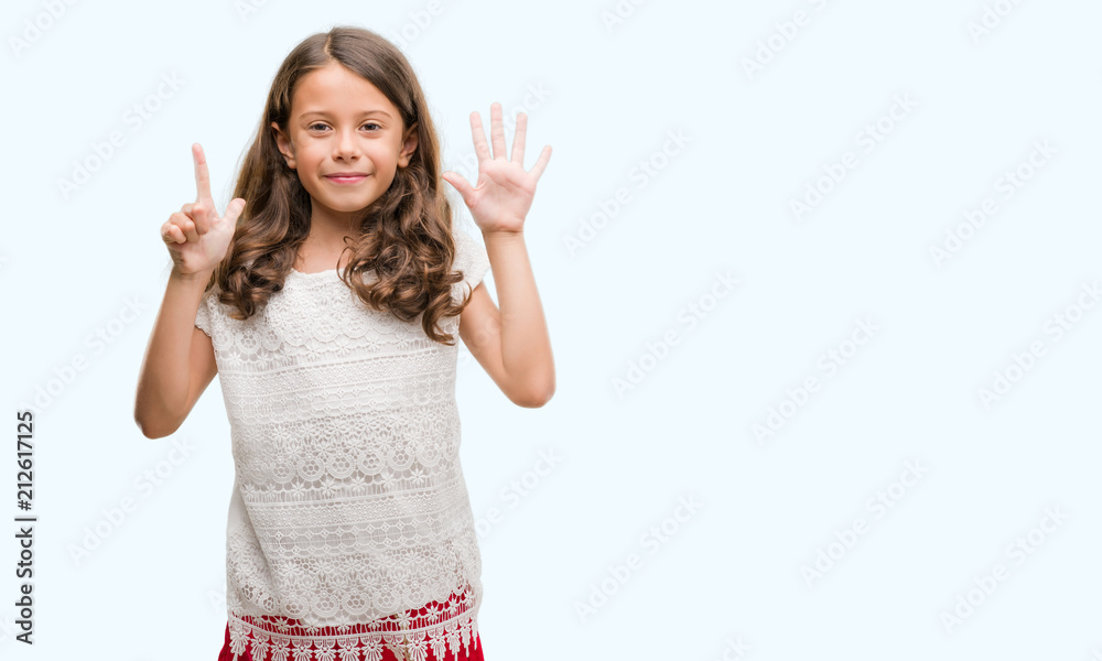 Brunette hispanic girl showing and pointing up with fingers number seven while smiling confident and happy. Brunette hispanic girl showing and pointing up with fingers number seven while smiling confident and happy.