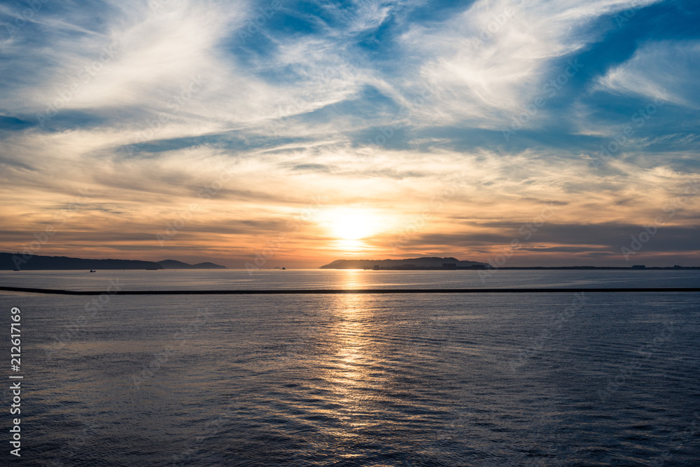 sunlight rebounding from ripple sea water at sunset sunrise time